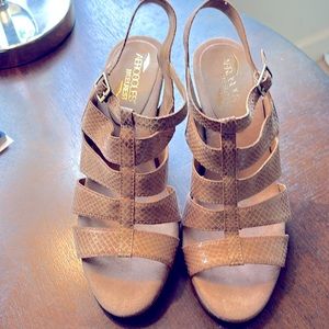 Tan sandals with a snakeskin pattern and 3” heels. Almost new!